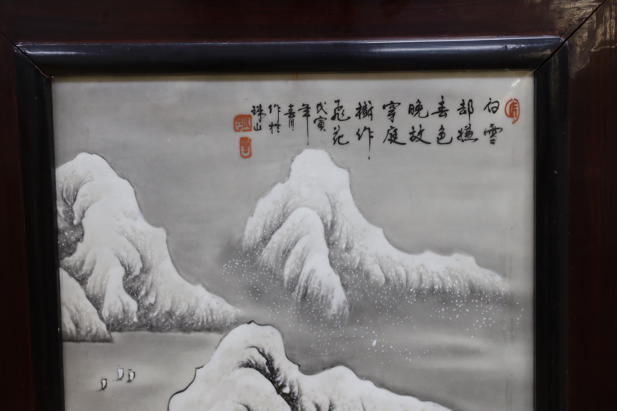 A Chinese framed porcelain plaque decorated with a winter scene, 31 cms wide x 54 cms high (not including frame)